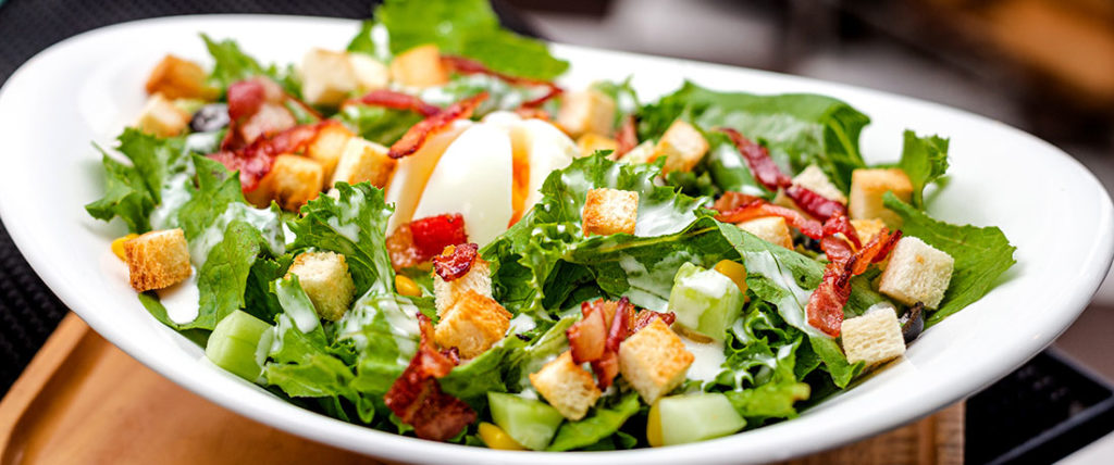 A salad in a white bowl