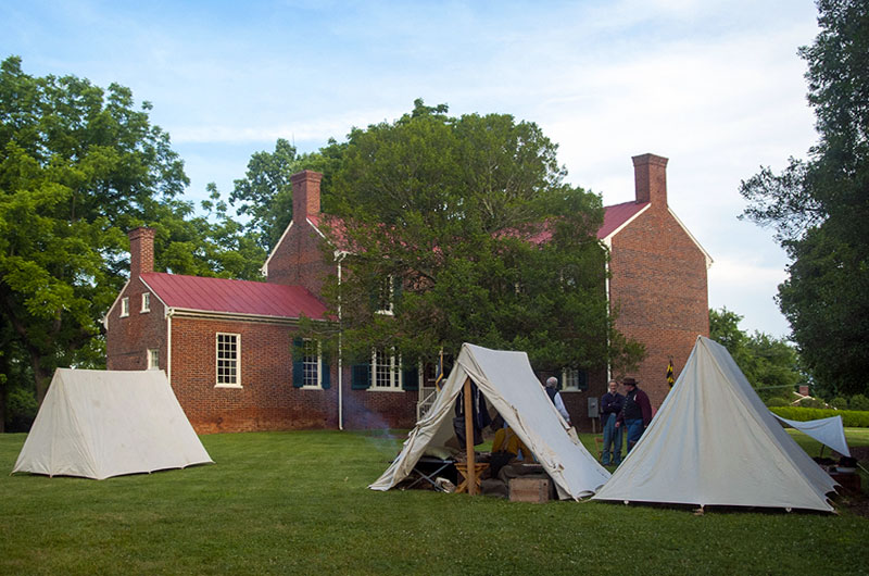 Historic Sandusky's rear lawn with several white tents